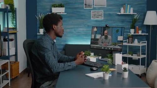 Man on Video Call in Home Office Setting