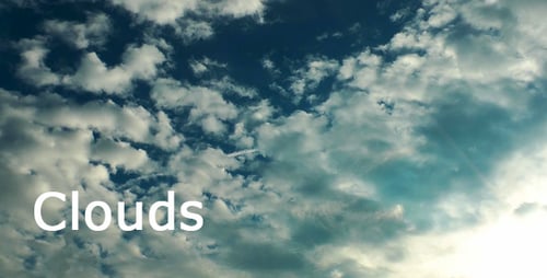 White Clouds Moving Across a Blue Sky