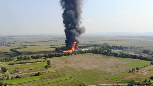 Aerial View of Huge Fire View From Quadcopter. Black Smoke Rises High Into the Sky. Fire on the