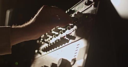 Crop Man Using Illuminated Amplifier