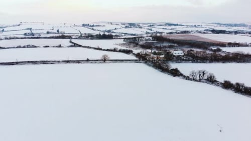 Snowy Fields and Farmland Aerial View