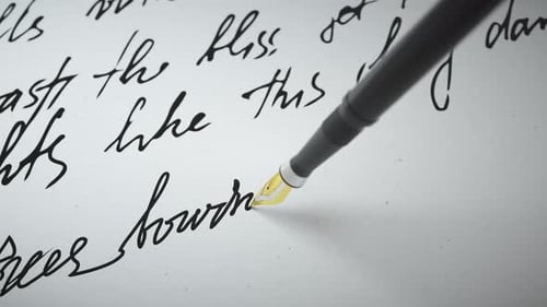 Ink Pen Writes Verse on Paper Close Up