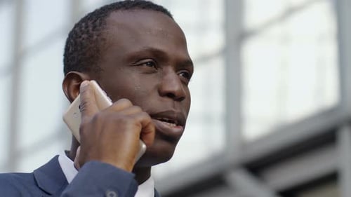 Black African Young Business Man Talking by Phone- Close up Portrait
