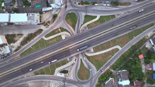 Aerial view of traffic on the main road passing Phetchaburi at dawn.