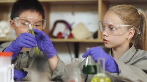 Children Doing Science Experiment with Beakers and Chemicals