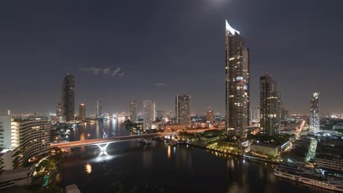Time lapse of aerial view of Taksin Bridge with Chao Phraya River, Bangkok Downtown