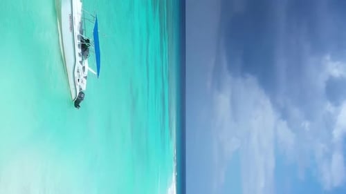 Tropical Island with Coconut Palm Trees and Turquoise Caribbean Sea with Floating Boats