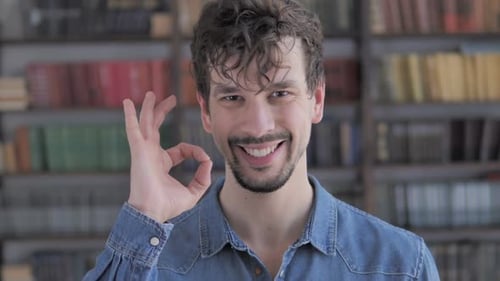 Young Man Giving OK Hand Gesture