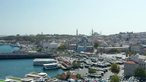Rush Hour at Grand Bazaar in Istanbul with Bus and Cars and Mosque on a Hill, Slow Aerial Drone