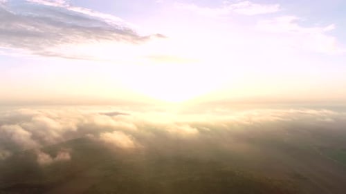 Aerial Over Foggy Rural Landscape at Sunrise