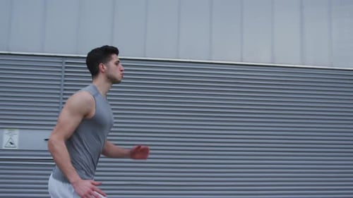 Man Jogging Outside in Urban Environment
