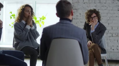 Adult Group Therapy Session in Bright Room