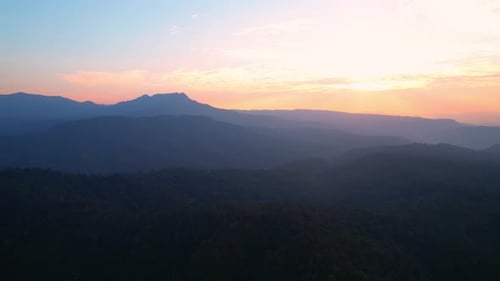 4K Aerial view over the mountains at sunset. Drone Flight Footage