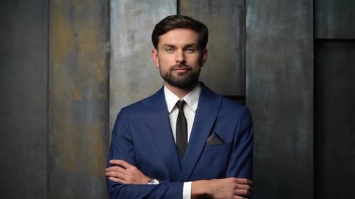 Confident Man in Blue Suit Stands Smiling