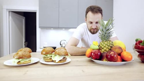 Man Is Choosing Between Healthy Food And Fast Food