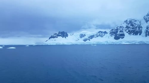 Beautiful Snowcapped Mountains Against the Blue Sky in Antarctica
