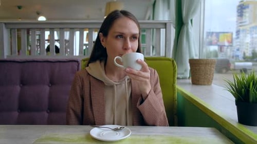 Female Drink Coffee in Cafe