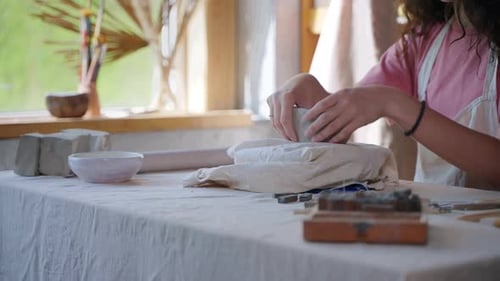 Creative Person Making Handmade Ceramics in Pottery Studio