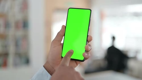 African Man Using Smartphone with Green Chroma Key Screen