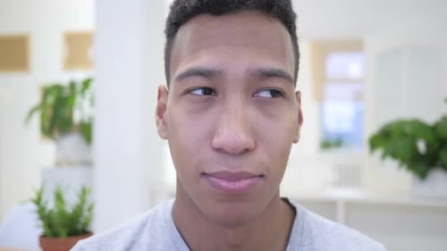 Young Adult Rolls Eyes Close Up