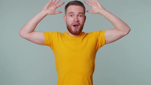 Man Reacts in Shock and Astonishment