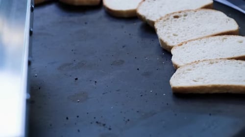Bread Slices Arranged on Flat Top