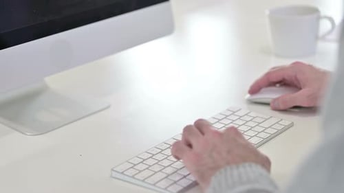 Man Typing on Keyboard, Working on Computer