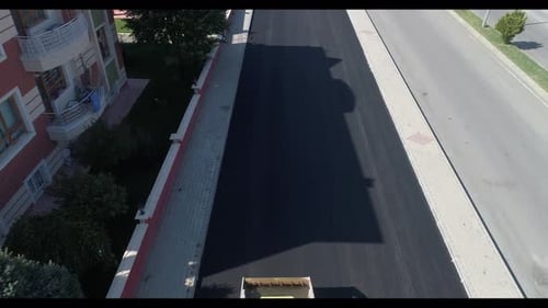 Aerial View of Road Paving in Residential Area