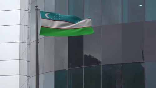 Uzbekistan Flag Waving on a Modern Building