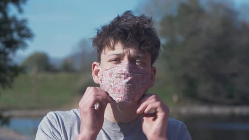 Young Adult Wearing Face Mask Outdoors