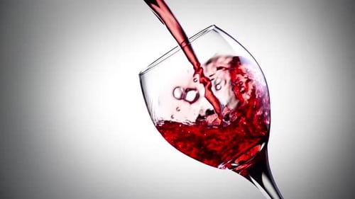Red Wine Being Poured into Glass Close Up