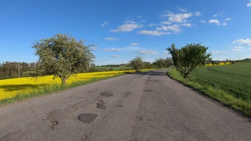 Car driving in spring in europe rural countryside
