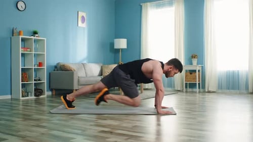 Young Man Is Doing Mountain Climber Exercise