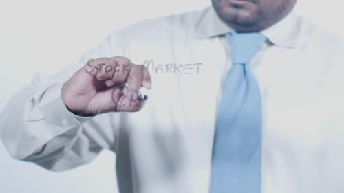 Asian Businessman Writes Stock Market Crash