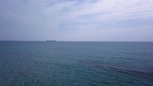 Drone Is Flying Over Blue Sea Water in Daytime