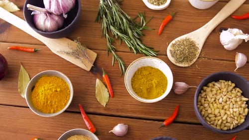 Colorful Spices and Seasonings on Wooden Table