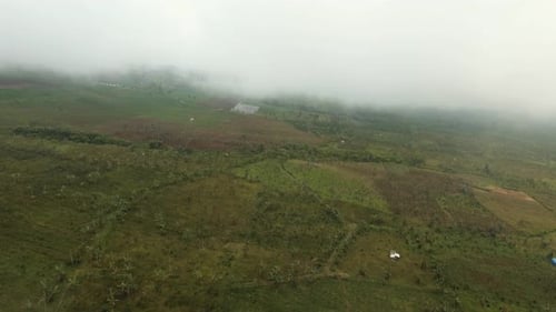 Farmland in the Mountains in the Fog. Jawa Island, Indonesia