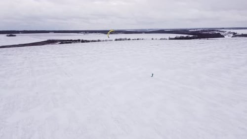 SnowKiting Kitesurfing Sport on the Ice Lake Winter