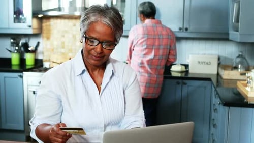 Senior Woman Shopping Online with Credit Card