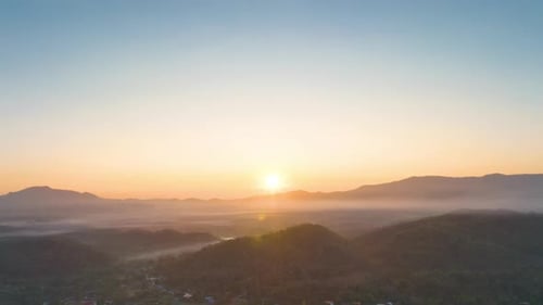 Aerial view Beautiful of morning scenery Golden light sunrise And the mist flows on high mountains.