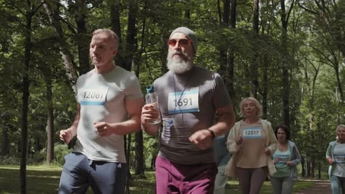 Several Old Marathon Runners Running in Park