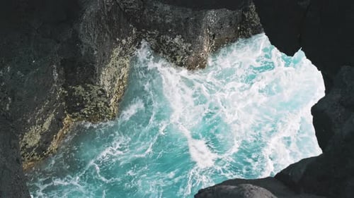 Turquoise Sea Waters Washing Rocky Volcanic Shore