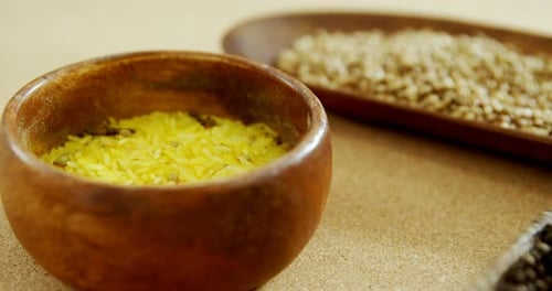 Spices and Rice in Wooden Bowls