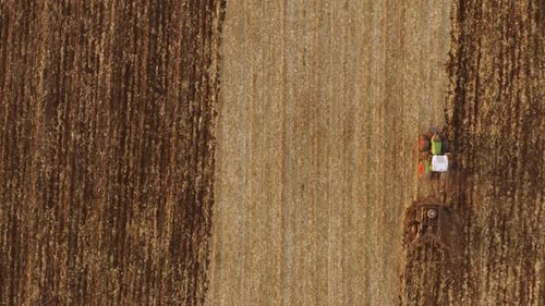 Tractor Working on Field in Autumn Season