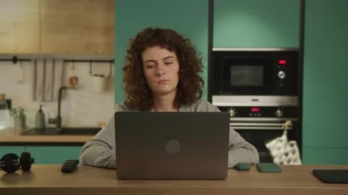 Young 20s Adult Student Reading Sad News and Closing Her Laptop
