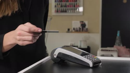 Woman Female Makes Card Payment at Check-in Desk of Hotel, Detail, Business Woman in Hotel Lobby Pay
