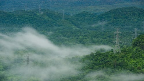 Aerial view high voltage power transmission towers.