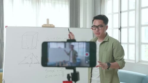 Teacher Explaining Math with Whiteboard and Equations