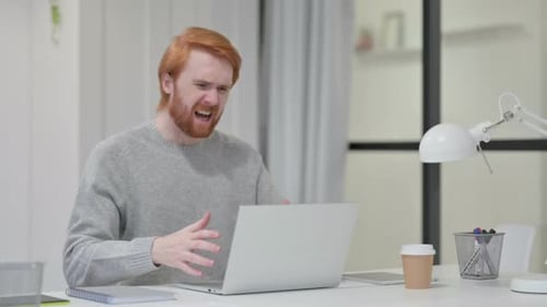 Man Frustrated with Laptop in Bright Office