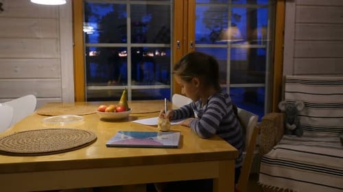Pretty School Girl at Home, Writing a Homework. Child Sitting at Table and Write